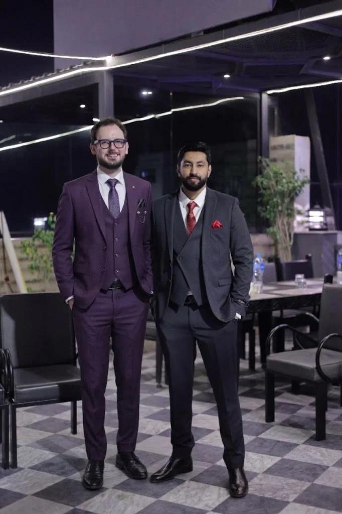 Two members of the team posing together at the evening venue